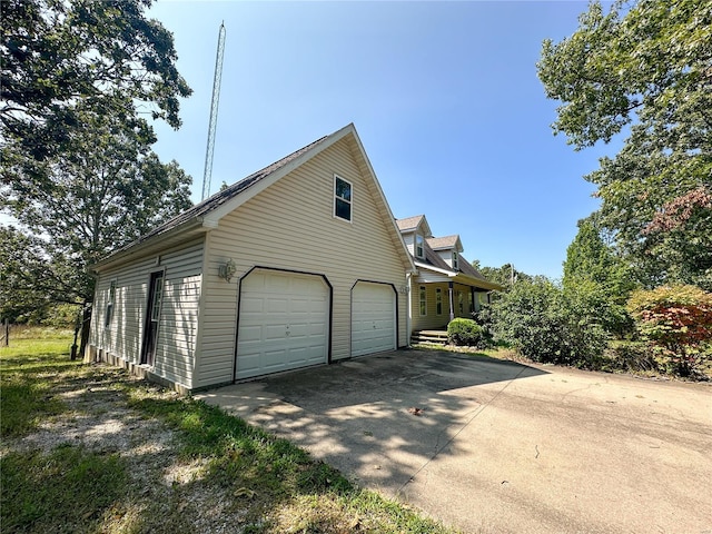 view of side of home with a garage