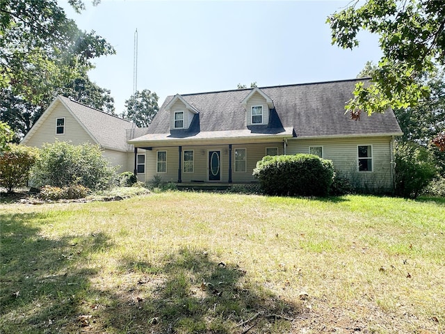 cape cod-style house featuring a front lawn