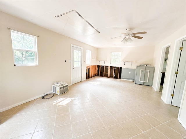 interior space with a healthy amount of sunlight and ceiling fan