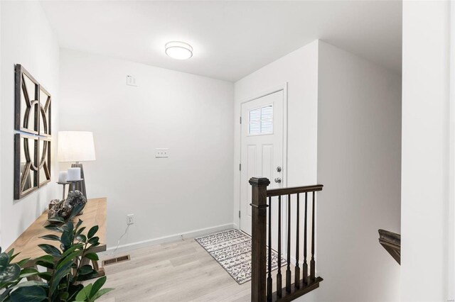 entrance foyer with light hardwood / wood-style flooring