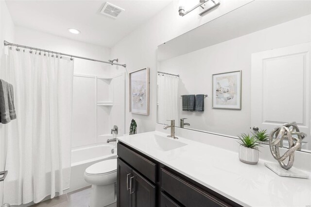 full bathroom featuring vanity, toilet, shower / tub combo, and tile patterned floors