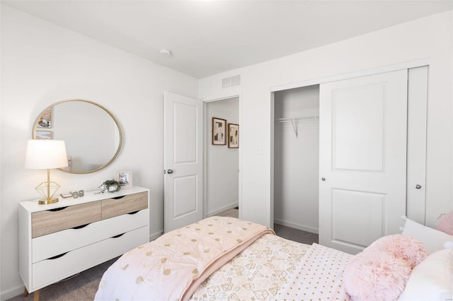 bedroom featuring visible vents, baseboards, a closet, and dark carpet