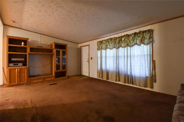 unfurnished living room featuring a textured ceiling and carpet