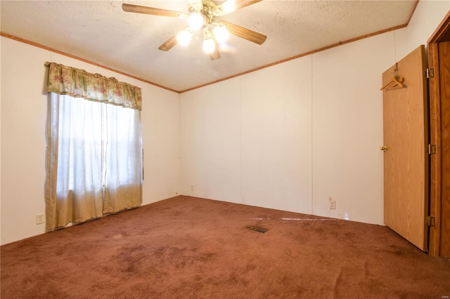 unfurnished room featuring lofted ceiling, carpet flooring, ceiling fan, and a textured ceiling