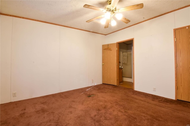 unfurnished room featuring ornamental molding, ceiling fan, carpet, and a textured ceiling