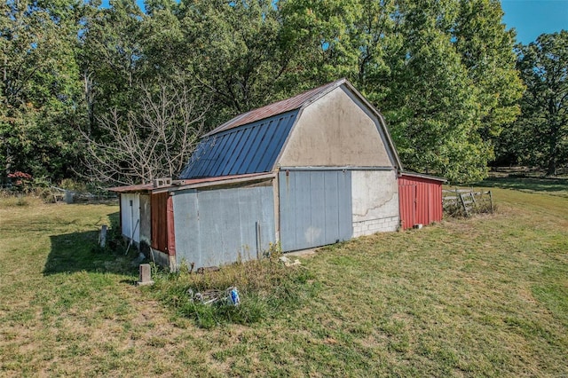 view of outbuilding with a lawn