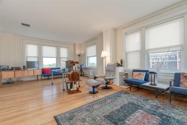 sitting room with light hardwood / wood-style flooring