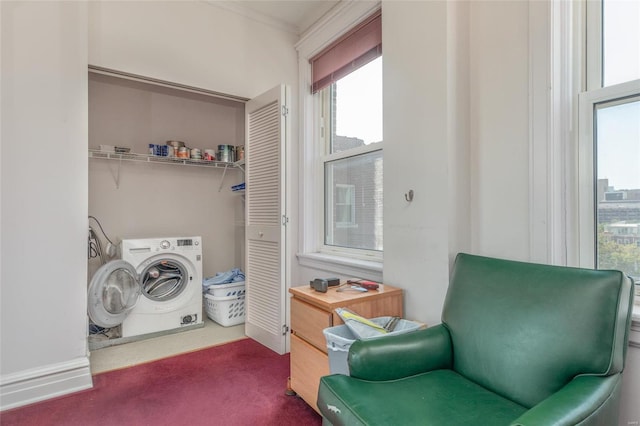 clothes washing area with washer / dryer and carpet flooring