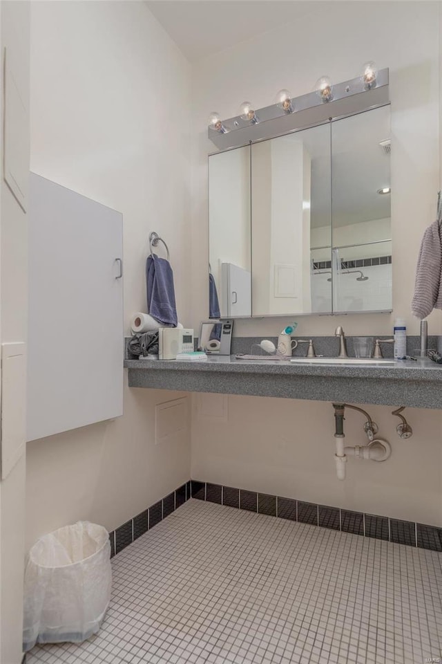 bathroom with tile patterned flooring