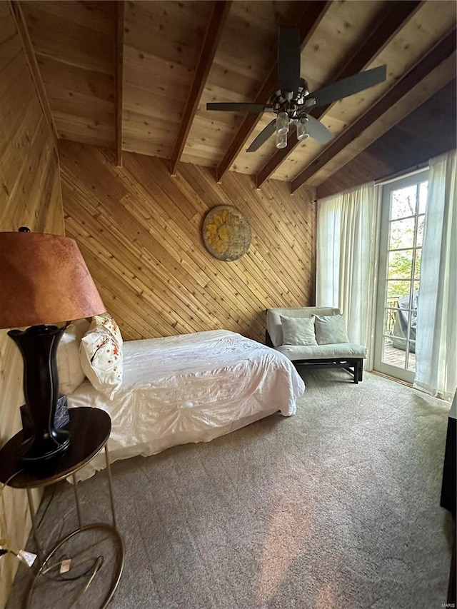 carpeted bedroom featuring beamed ceiling, wood ceiling, access to outside, ceiling fan, and wood walls