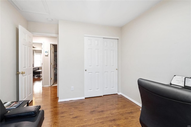 home office with dark hardwood / wood-style flooring