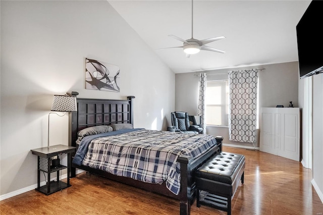 bedroom with lofted ceiling, ceiling fan, and hardwood / wood-style floors