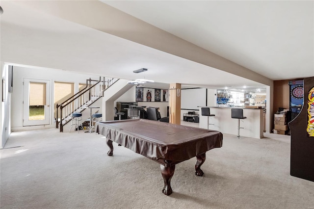 rec room featuring bar, pool table, and light carpet