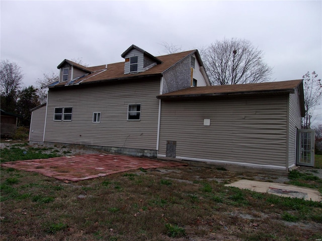 view of side of property featuring a patio