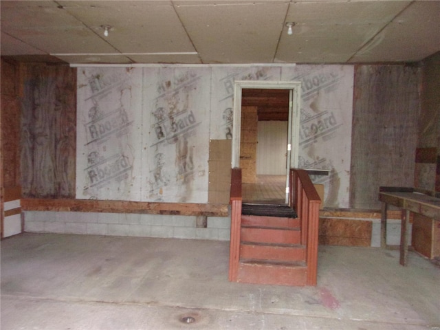 basement featuring a drop ceiling