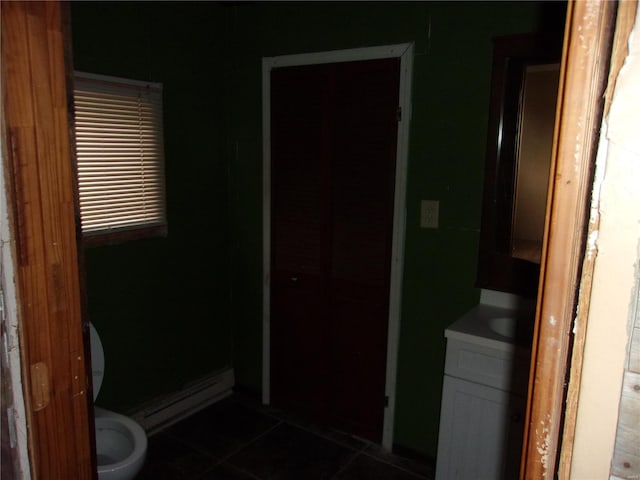 bathroom with tile patterned floors, vanity, and toilet