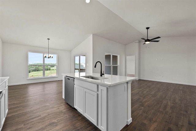 kitchen featuring ceiling fan with notable chandelier, sink, lofted ceiling, an island with sink, and stainless steel dishwasher