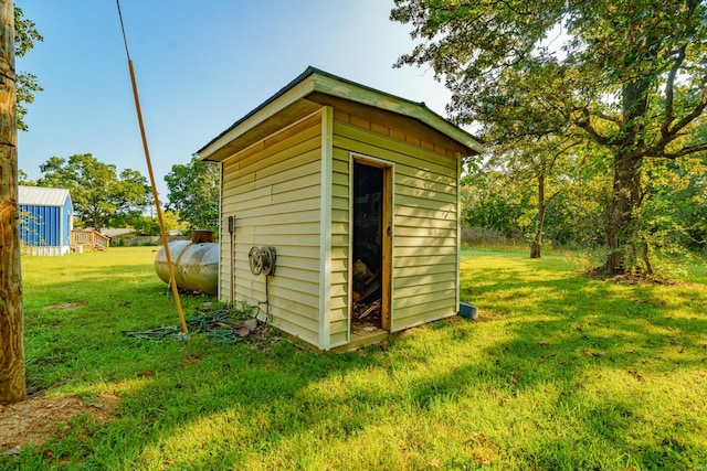 view of outdoor structure with a lawn