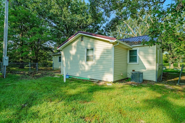 back of house with a yard