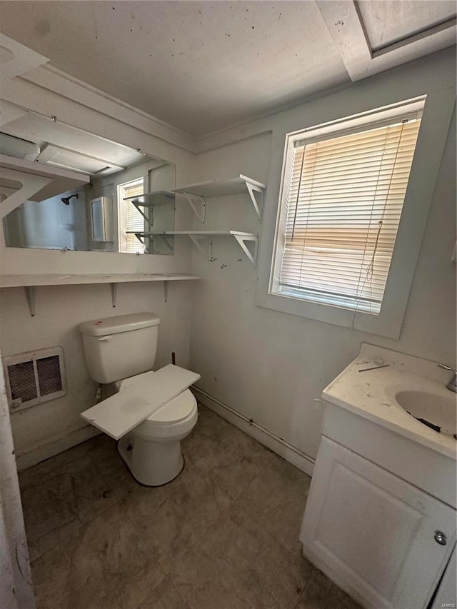 bathroom with toilet and vanity