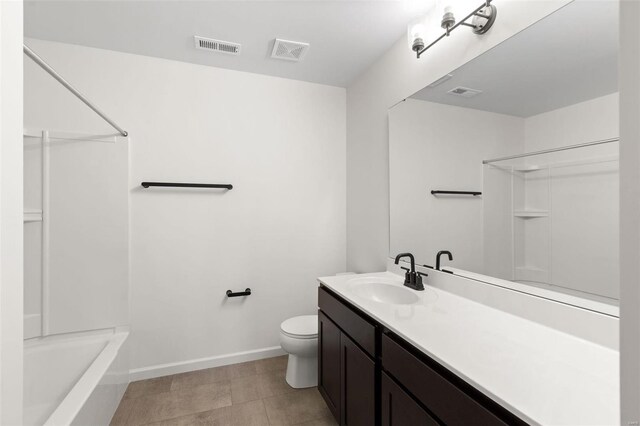 full bathroom with vanity, toilet, tile patterned floors, and washtub / shower combination