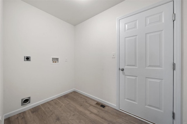 clothes washing area featuring hookup for a washing machine, hookup for an electric dryer, and light hardwood / wood-style floors