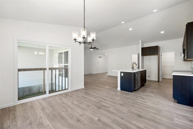 kitchen with a center island with sink, stainless steel dishwasher, sink, and light hardwood / wood-style flooring