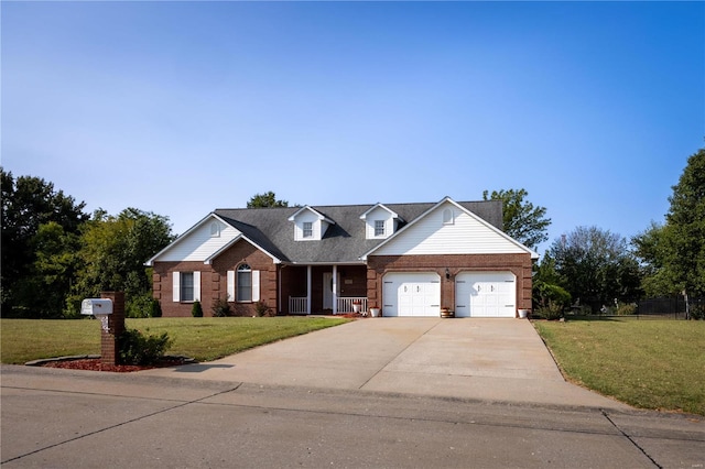 view of front facade featuring a front lawn, a garage, and a porch