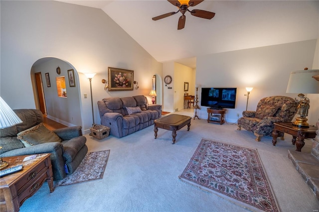 carpeted living room featuring high vaulted ceiling and ceiling fan