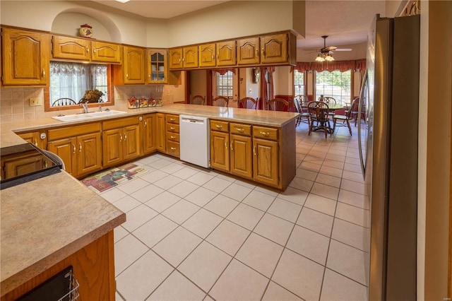 kitchen featuring stainless steel fridge, dishwasher, kitchen peninsula, sink, and ceiling fan