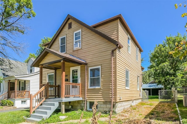 view of front facade with central AC and a porch