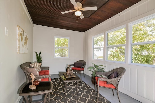 sunroom with wood ceiling, plenty of natural light, and ceiling fan