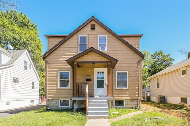 view of front of property with cooling unit and covered porch