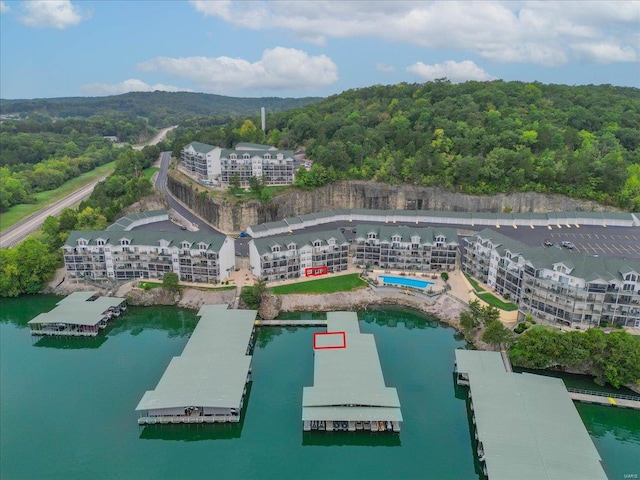 birds eye view of property with a water view