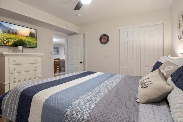 bedroom featuring ceiling fan and a closet