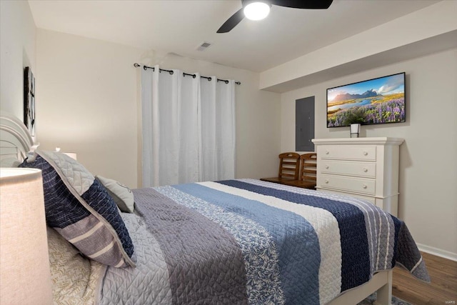 bedroom featuring hardwood / wood-style floors and ceiling fan