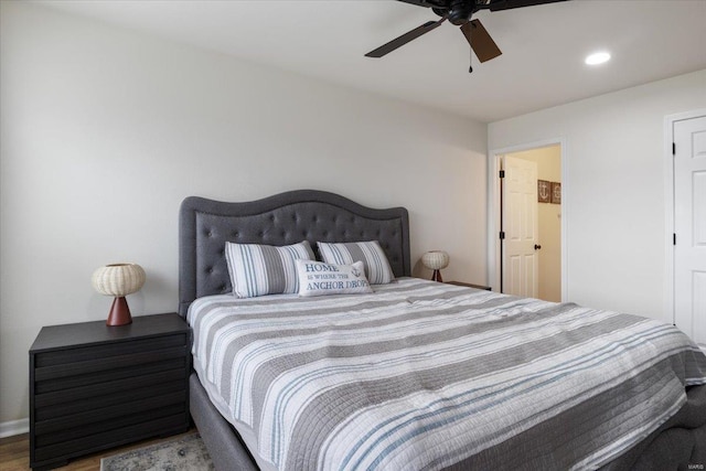 bedroom featuring hardwood / wood-style flooring and ceiling fan