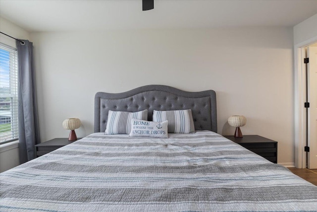 bedroom featuring ceiling fan and hardwood / wood-style flooring