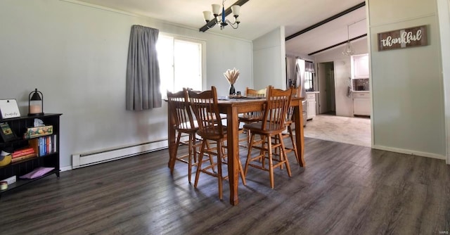 dining area with a baseboard heating unit, lofted ceiling, dark hardwood / wood-style floors, and a notable chandelier