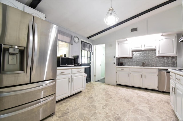 kitchen with white cabinetry, appliances with stainless steel finishes, tasteful backsplash, lofted ceiling, and hanging light fixtures