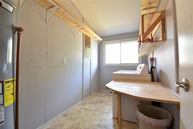 laundry area with washer and dryer and water heater