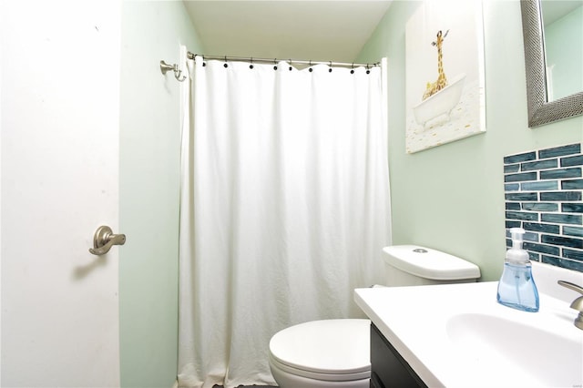 bathroom with toilet and vanity