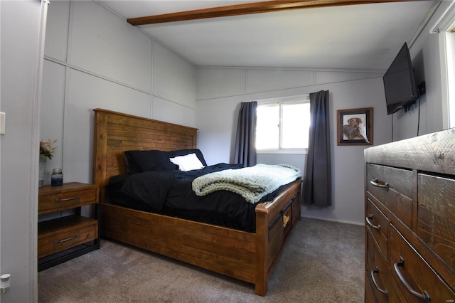 bedroom featuring lofted ceiling and dark colored carpet