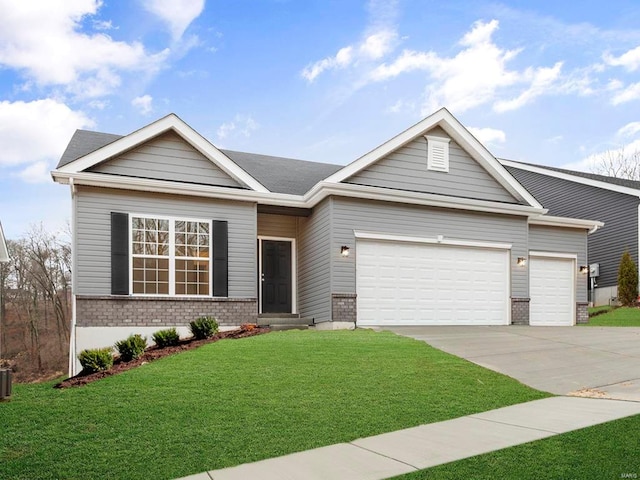 view of front of home with a front lawn and a garage