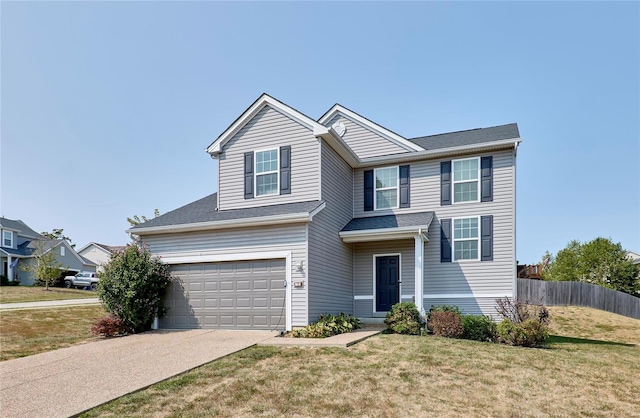 view of front of home with a garage and a front lawn