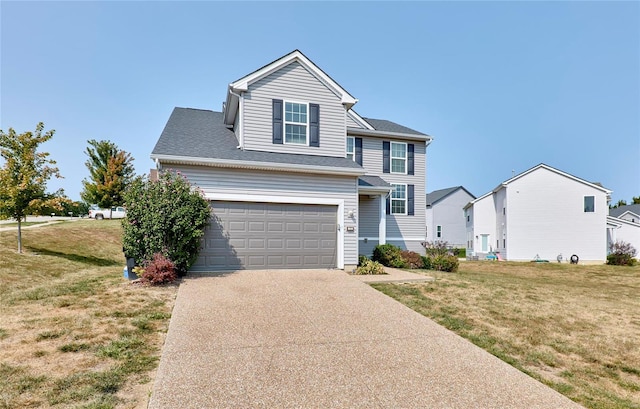 view of front property featuring a garage and a front yard