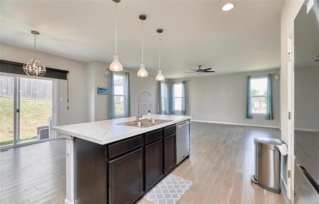 kitchen with a wealth of natural light, stainless steel dishwasher, and sink