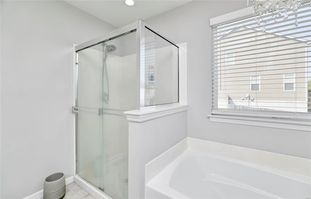 bathroom with shower with separate bathtub