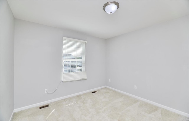 unfurnished room featuring carpet