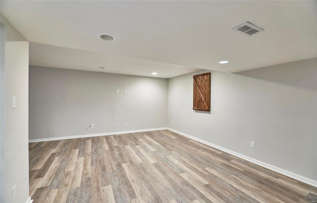 empty room with hardwood / wood-style floors